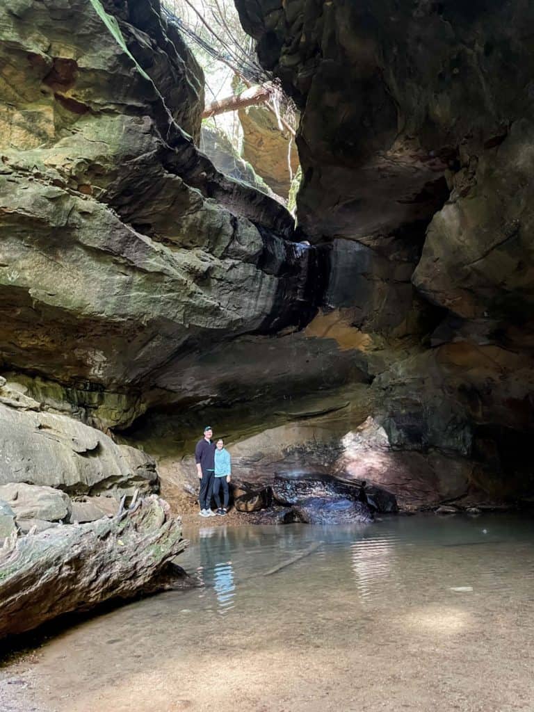 Couple smiling by waterfall at Conkle's Hollow Ohio